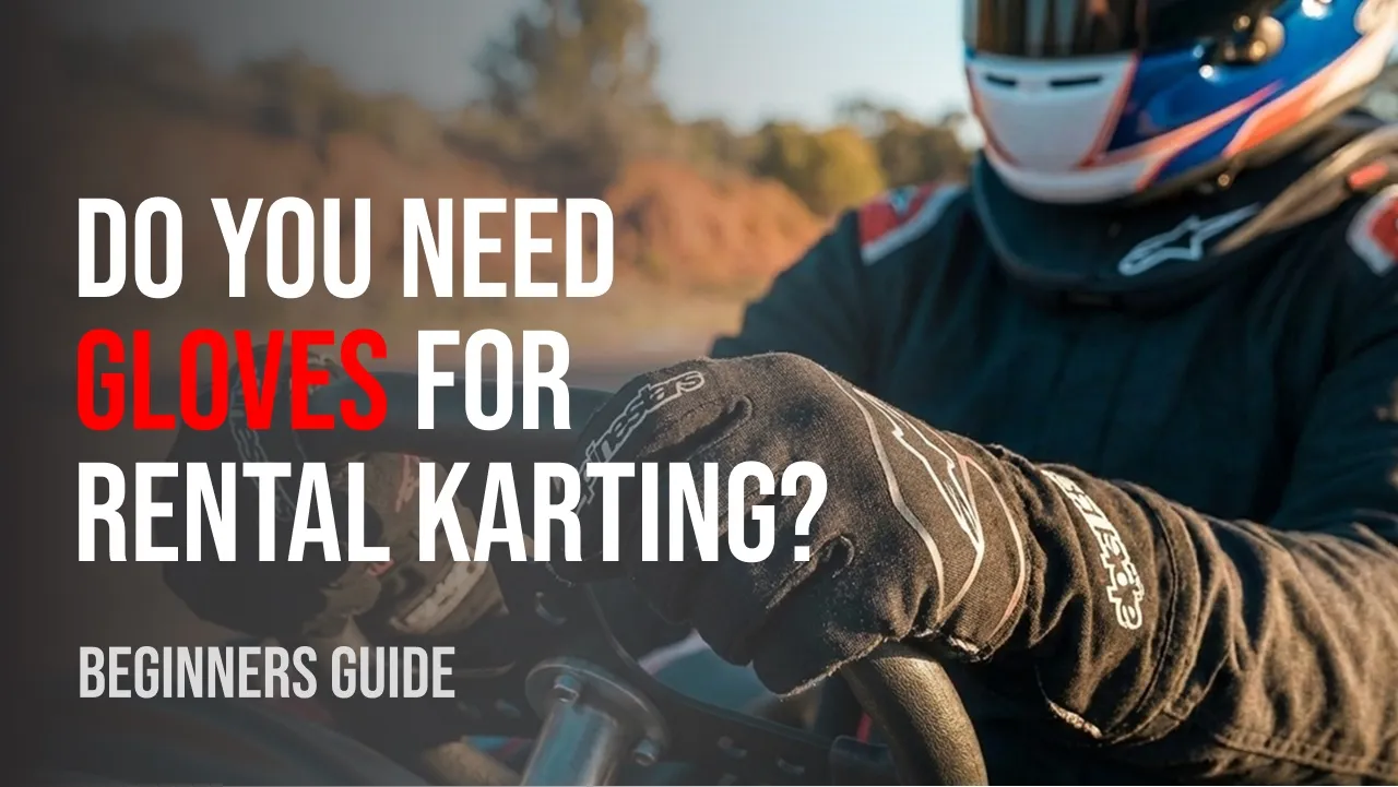 Racing gloves resting on a go-kart steering wheel